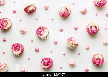 Pink cupcake background on white Stock Photo