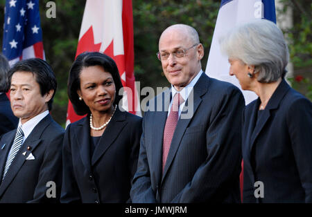 Washington, DC- October 11, 2008 -- U.S. Secretary of State Condoleeza Rice and U.S. Secretary of the Treasury Henry Paulson (center) with G7 Finance Ministers Japanese Finance Minister Shoichi Nakagawa (left) and France's Finance Minister Christine Lagarde as U.S. President George W. Bush  delivers remarks on the economy from the Rose Garden of the White House in Washington, D.C. USA 11 October 2008.   Credit: Chris Usher / Pool via CNP