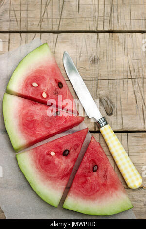 Watermelon slices on a wooden table Stock Photo