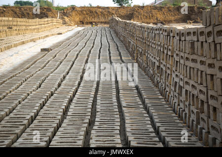 AMRITSAR, PUNJAB, INDIA - 21 APRIL 2017 : bricks lined up to dry at a brick manufacturing facility in India Stock Photo