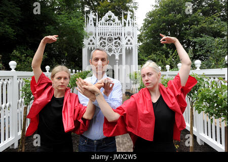 A rehearsal of Pablo Bronstein's (centre) ballet The Rose Walk is performed by classically trained dancers Rosalie Wahlfrid and Emilia Gasiorek (left) at the Jupiter Artland in West Lothian, which was commissioned for this year's Edinburgh Art Festival. Stock Photo