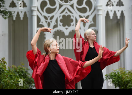 A rehearsal of Pablo Bronstein's ballet The Rose Walk is performed by classically trained dancers Rosalie Wahlfrid and Emilia Gasiorek (left) at the Jupiter Artland in West Lothian, which was commissioned for this year's Edinburgh Art Festival. Stock Photo