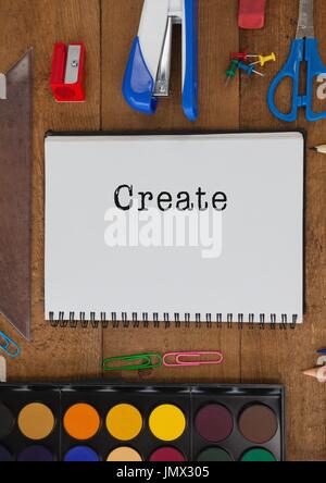 Digital composite of Create  text written on page with stationery Stock Photo