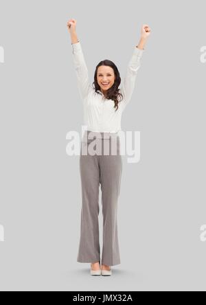 Digital composite of Full body portrait of woman standing with grey background Stock Photo