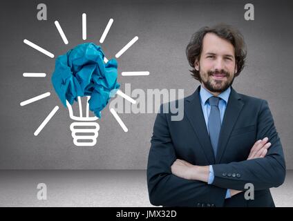 Digital composite of Man standing next to light bulb with crumpled paper ball Stock Photo