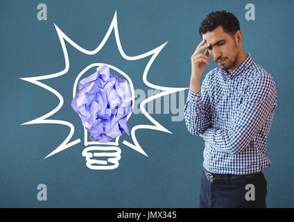 Digital composite of Man standing next to light bulb with crumpled paper ball Stock Photo