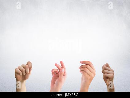 Digital composite of Four hands with bright background Stock Photo