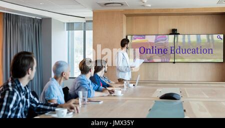 Digital composite of People looking at a TV with e-learning information in the screen Stock Photo