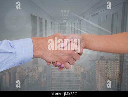 Digital composite of Business people shaking hands against office and city background Stock Photo