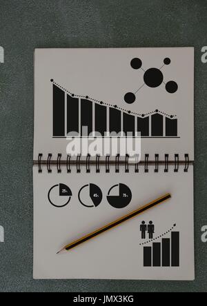 Digital composite of Business Charts and statistics drawn on notepad Stock Photo