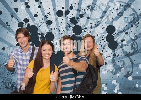 Digital composite of Happy young students against blue splattered background Stock Photo