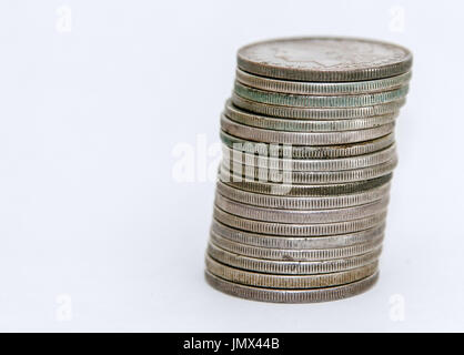 Stack of Morgan Dollar coins on white background. Stock Photo