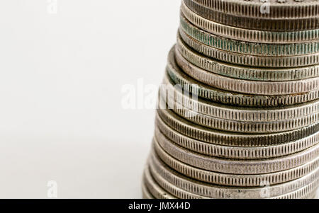 Stack of Morgan Dollar coins on white background. Stock Photo