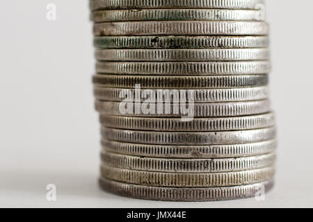Stack of Morgan Dollar coins on white background. Stock Photo