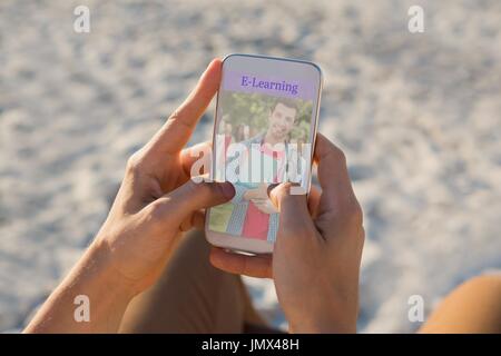 Digital composite of Person using a phone  with e-learning information in the screen Stock Photo