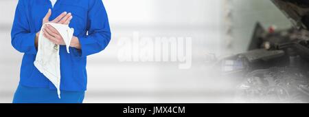 Digital composite of Mechanic man cleaning his hands Stock Photo