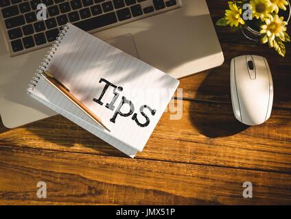 Digital composite of Tips  text written on page with laptop Stock Photo