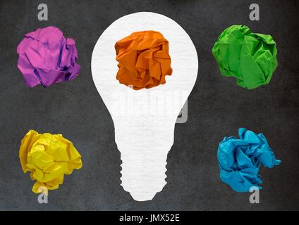 Digital composite of light bulb with crumpled paper ball in front of blackboard Stock Photo