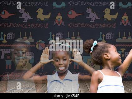Digital composite of Girl transition effect fading with blackboard background and toys graphics Stock Photo