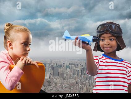 Digital composite of Kids with toy plane over city Stock Photo