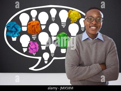 Digital composite of Man standing next to light bulbs chat bubble with crumpled paper balls in front of blackboard Stock Photo