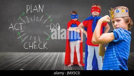 Digital composite of Superhero kids and king crown boy with blackboard background and plan graphics Stock Photo