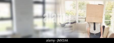 Digital composite of Man with a box on his head in his new house Stock Photo