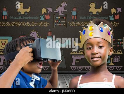 Digital composite of Boy with VR Headset and girl with crown in front of blackboard with toys graphics Stock Photo