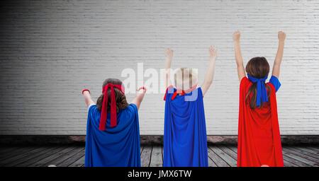 Digital composite of Superhero kids with blank room background Stock Photo