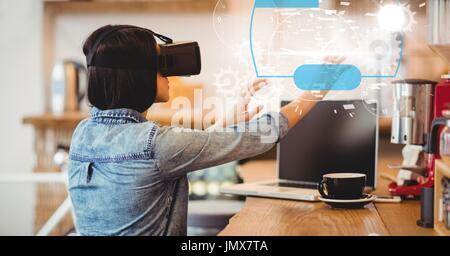 Digital composite of Digital composite image of woman using VR glasses Stock Photo
