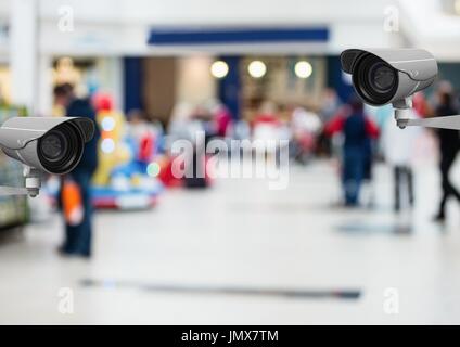 Digital composite of CCTV cameras against defocused background Stock Photo