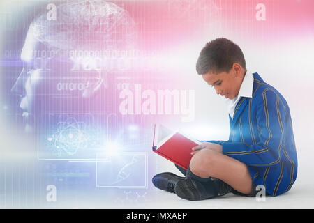Digitally image of brain interface against schoolboy reading book on white background Stock Photo
