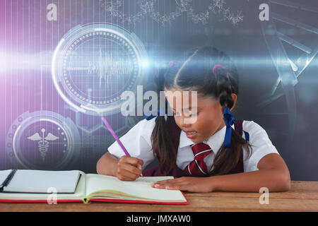 Digital composite image of DNA helix against schoolgirl doing her homework against chalkboard Stock Photo