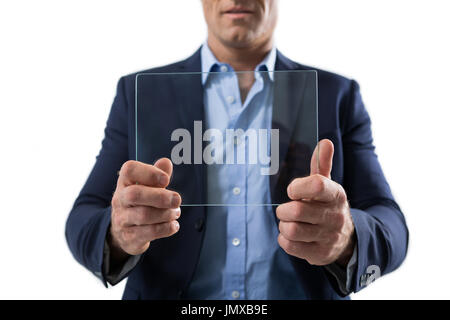 Mid section of businessman using a glass digital tablet against white background Stock Photo