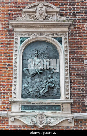 King John III Sobieski bas relief on St. Mary Church outdoor wall built in 1883. Krakow, Poland. Stock Photo