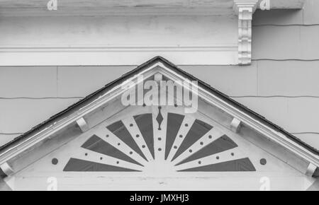 an ornate painted white pediment above a front door in Sag Harbor, NY Stock Photo