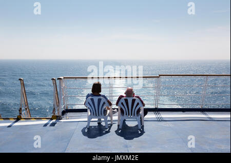 Couple cruising on a cross channel  ferry,  Brittany Ferry 'Bretagne', Brittany Ferries, from Portsmouth UK to St Malo France, Europe Stock Photo