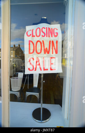 closing down sale sign in high street shop united kingdom Stock Photo