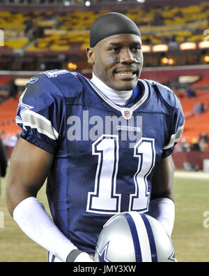 Dallas Cowboys' Roy Williams wears the jersey of teammate Marion