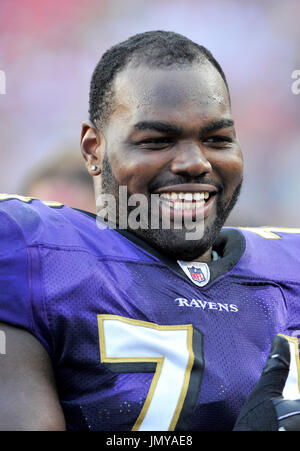 Buffalo Bills defensive tackle Marcell Dareus, center, passes Baltimore  Ravens tackle Michael Oher (74) to sack Ravens quarterback Joe Flacco (5)  during the second quarter at Ralph Wilson Stadium in Orchard Park