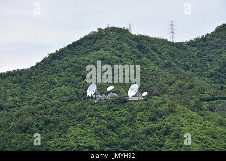 Satellite receiving and transmitting array antennas on mountain in Pingtung, Taiwan. For TV and internet, phones. Stock Photo