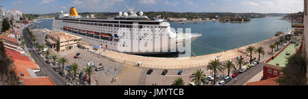 Panorama of the Harbour at Mahon, Menorca; the largest in Europe, featuring an enormous cruise ship Stock Photo