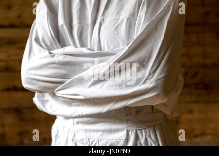 Woman with straitjacket, dark background Stock Photo