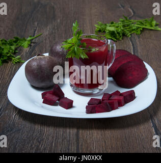 A mug of beet juice, cut into pieces of beetroot Stock Photo