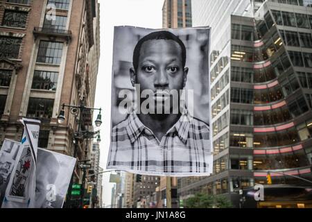 New York, New York, USA. 28th July, 2017. (Photo: Sachelle Babbar) Photo of the deceased Kalief Browder. In protest the policies of the Trump Administration and threats to various communities in America, artists, activists, and community members participated in a solidarity march to bring attention to those marginalized. The platforms were: respect for lives, economic and social equality, diversity, and freedom of expression. The participants marched in silence in white attire, in homage to the 1917 Silent Protest Parade. Kindred Arts was the event organizer. The Silent Parade Stock Photo