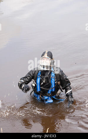 Builth Wells, Powys, Wales, UK. 29th July 2017. A diver emerges from the muddy waters of The river Wye. Two Specialist Search Units are seen on the banks of the River Wye at Builth Wells, Powys, Wales, UK. The units - South Wales Police Specialist Search Unit and Devon & Cornwall (D Section Force Support Group Marine Counter Terrorism & Underwater Search Unit) together comprising a total of five divers, continue the search for missing teenager, nineteen-year-old James Corfield, in Builth Wells, Powys, Wales, UK. and along the river Wye. Credit: Graham M. Lawrence/Alamy Live News Stock Photo
