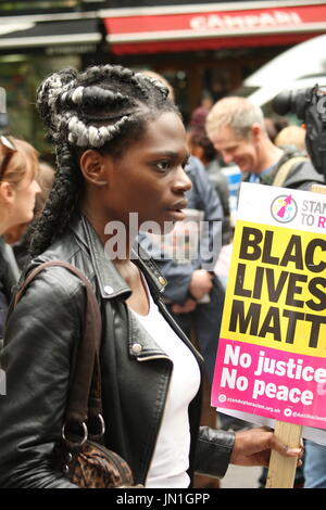 London, UK. 29th July, 2017. A protester holds a Black Live Matter placard, outside Stoke Newington police station. Called by Stand Up to Racism the protest focused on the recent death of Rashan Charles, after he was tackled by a police officer, and the death of Edson De Costa who also died following contact with the police a month ago. Roland Ravenhill/ Alamy Live News