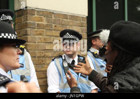 London, UK. 29th July, 2017. A young man from Stoke Newington questions local police. A protest takes place outside Stoke Newington police station. Called by Stand Up to Racism the protest focused on the recent death of Rashan Charles, after he was tackled by a police officer, and the death of Edson De Costa who also died following contact with the police a month ago. Roland Ravenhill/ Alamy Live News Stock Photo