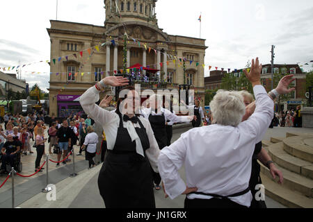 Hull,UK,29th July 2017,A Duckie Summer Tea Party takes place in Hull as part of LGBT 50. MC Amy Lamé and her waiters serve tea to the people of Hull outside City Hall. Music was provided by London Gay Big Band©Keith Larby/Alamy Live News