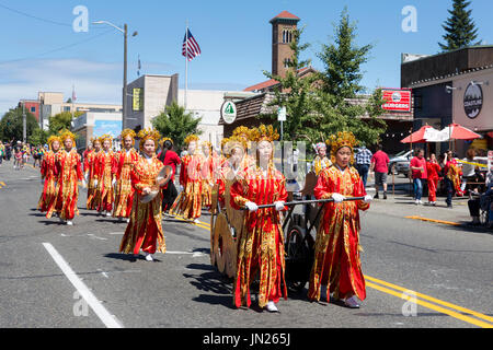 Seattle, Washington: Chinese Community Girls Drill Team performs at the West Seattle Grand Parade. The annual parade, hosted by the West Seattle Rotar Stock Photo